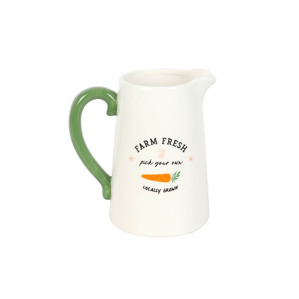 White pitcher with green handle and 'Farm Fresh' text on a white background
