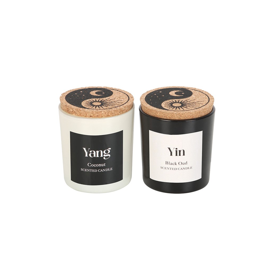 Two candles labeled 'Yang' and 'Yin' with cork lids on a white background.
