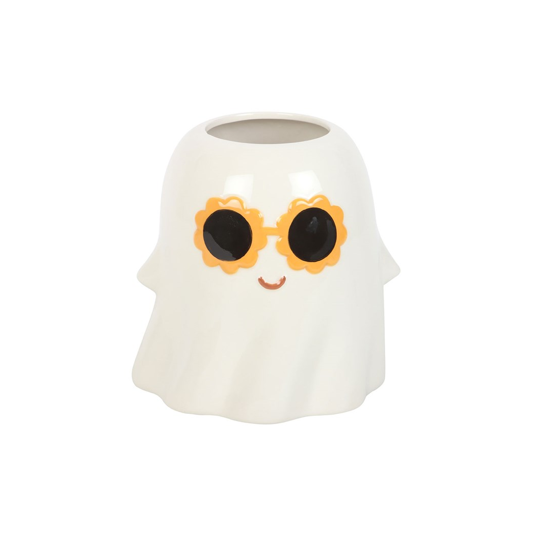 White ghost-shaped vase with black eyes and orange sunglasses on a white background