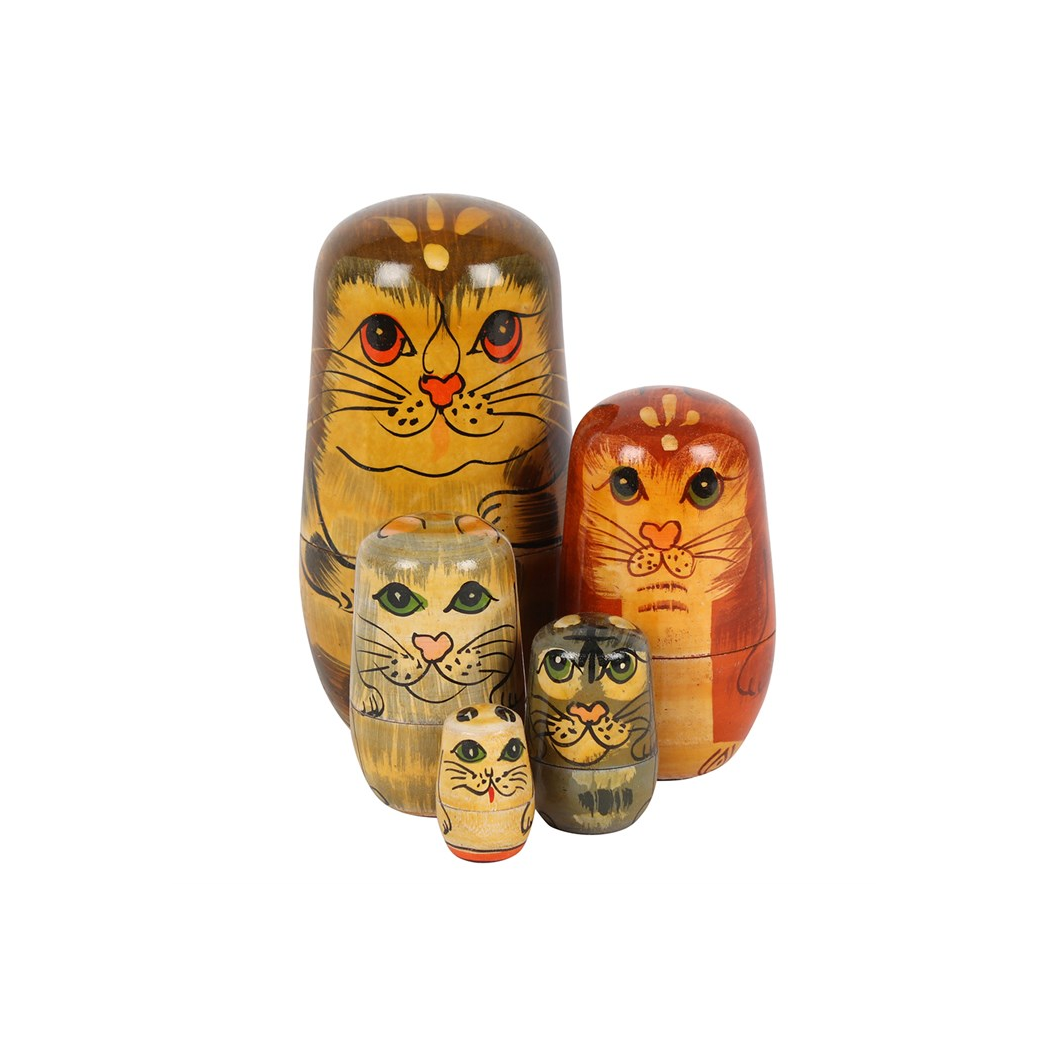 Set of four wooden nesting dolls with cat designs on a white background
