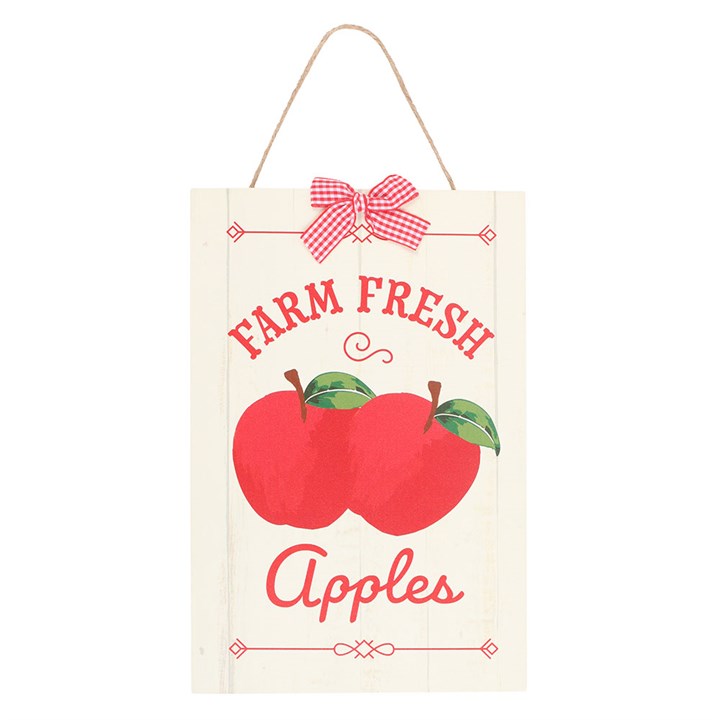 Decorative sign with 'Farm Fresh Apples' text and red apples on a white background