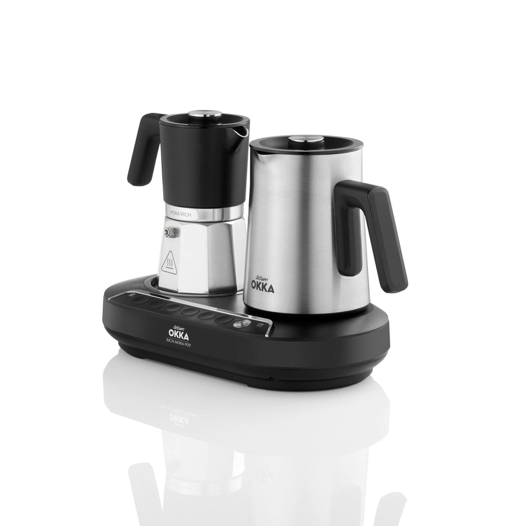 Coffee maker with two black spouts on a white background