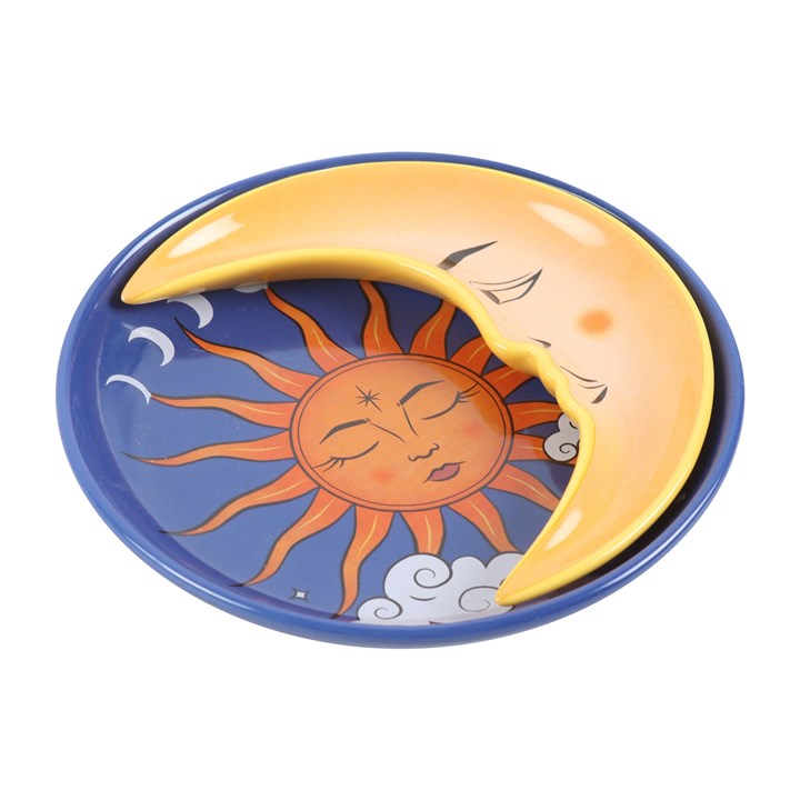 Ceramic plate with sun and moon design on a white background
