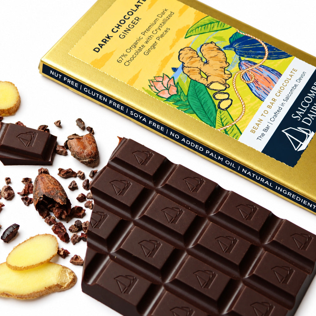 Dark chocolate bar with ginger pieces and Salcombe Dark Chocolate packaging on a white background