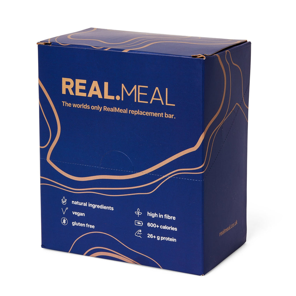 Blue box of RealMeal replacement bar with gold text on a white background