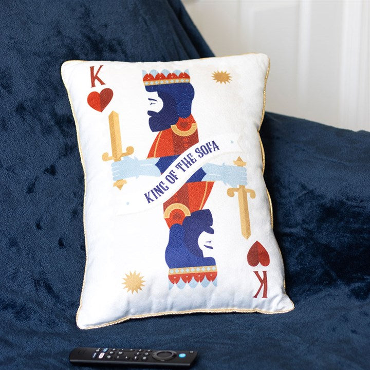 Decorative pillow with a king design on a blue sofa