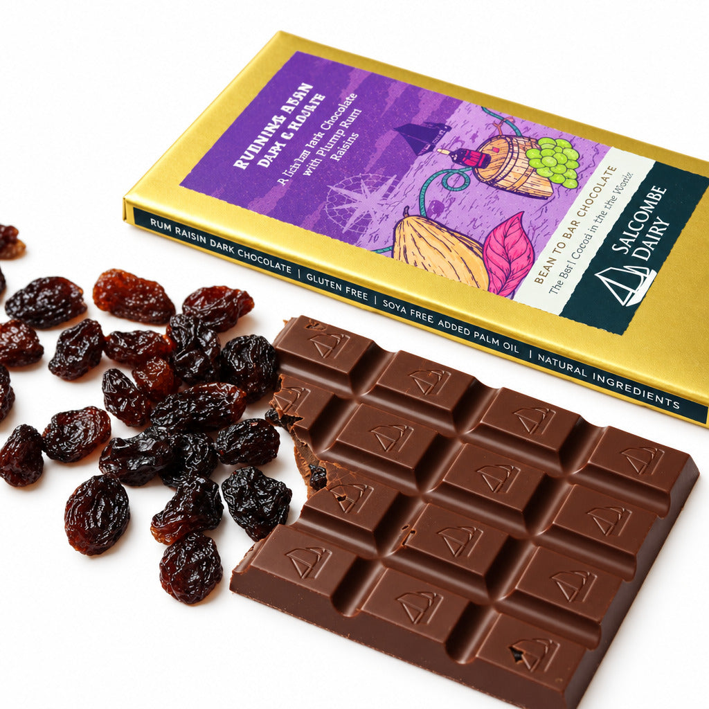 Chocolate bar with rum and raisins and a packaging box on a white background