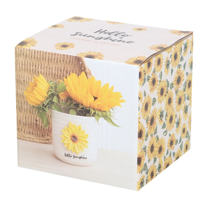 Ceramic plant pot with sunflower design and 'Hello Sunshine' text, wrapped in a decorative box with sunflower pattern.
