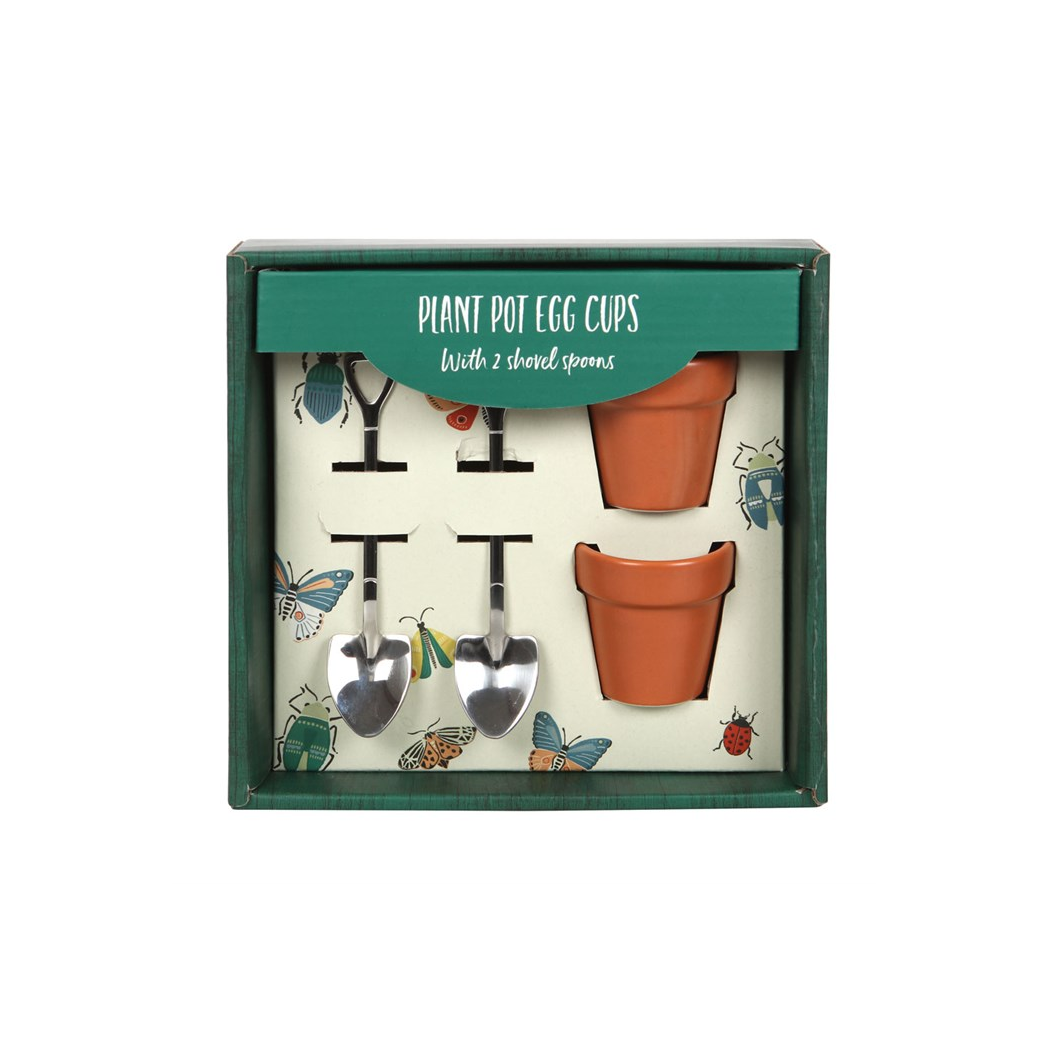 Set of plant pot egg cups with shovel spoons in packaging